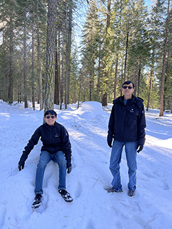 Preston and his brother Alex in a snowy forest